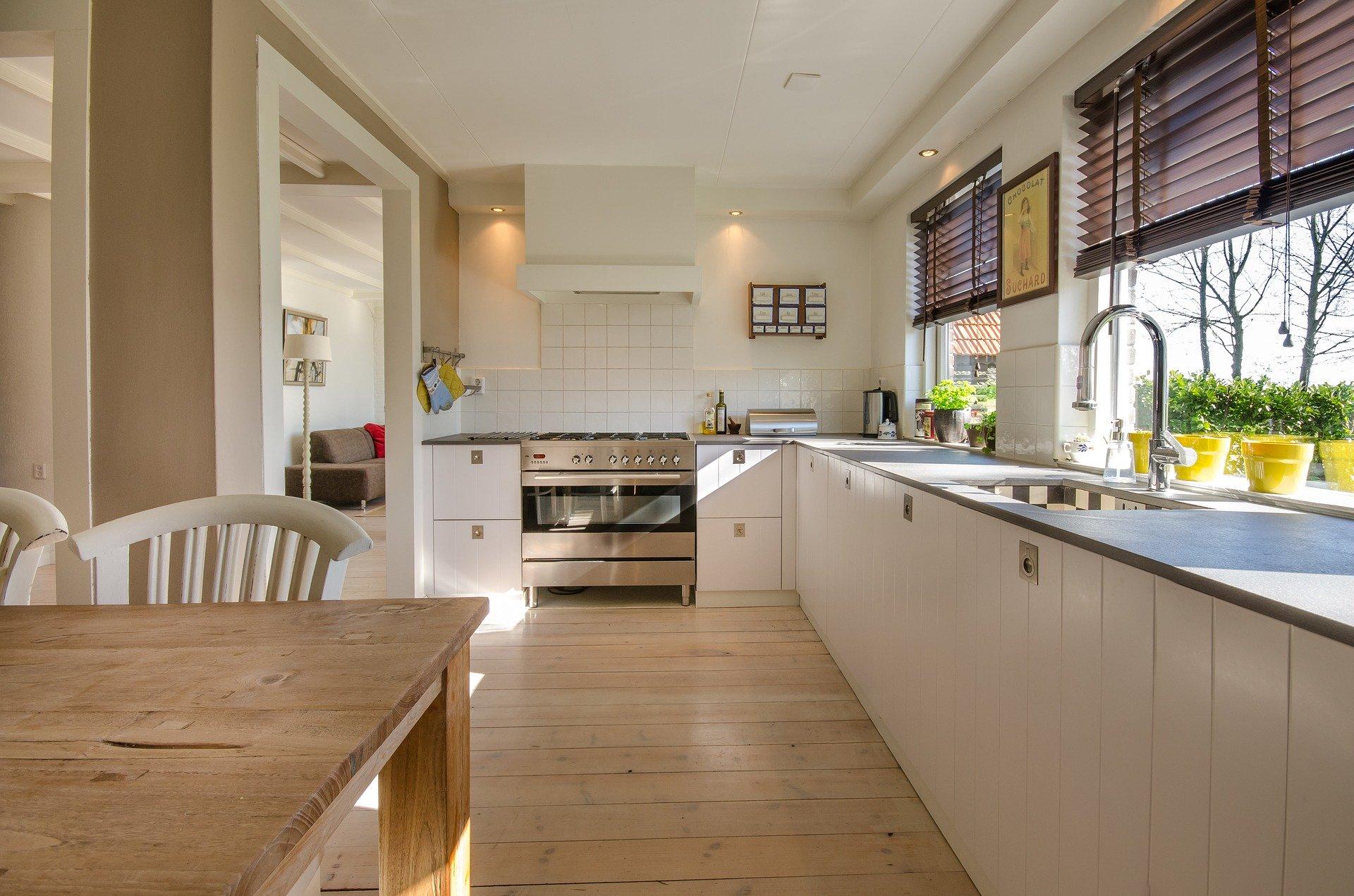 white kitchen with wooden table