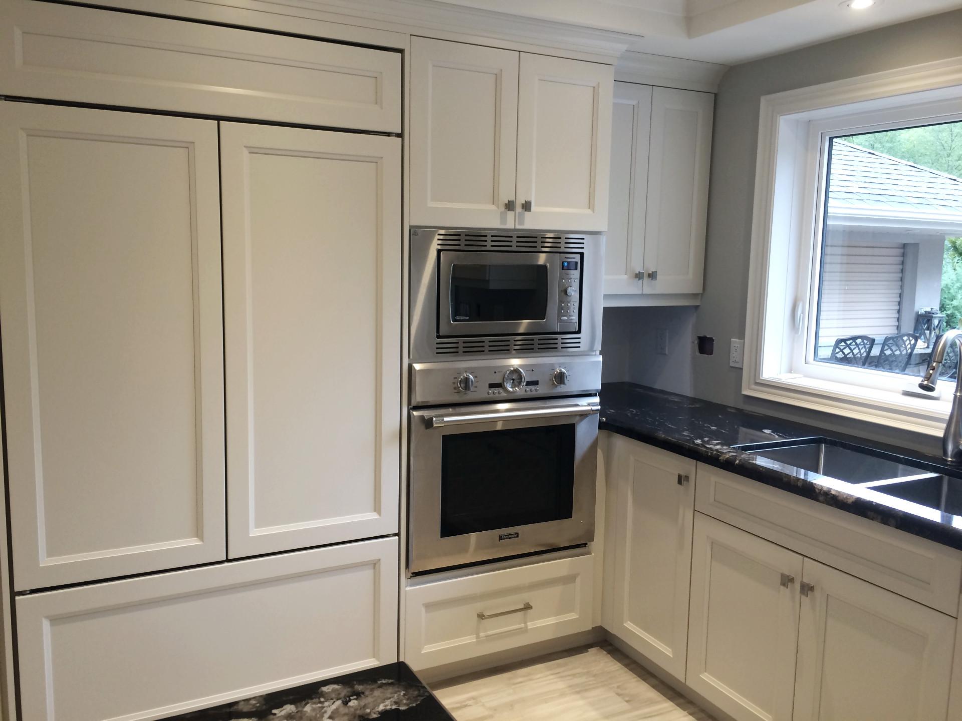 kitchen showing oven and microwave